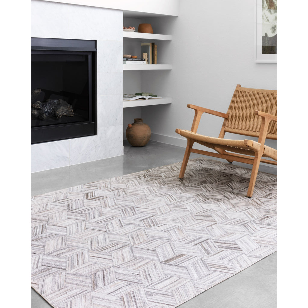 LT GREY AND IVORY MADDOX RUG IN LIVING ROOM NEXT TO FIREPLACE