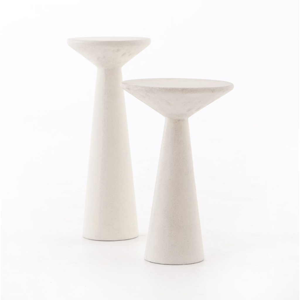 two white concrete side tables