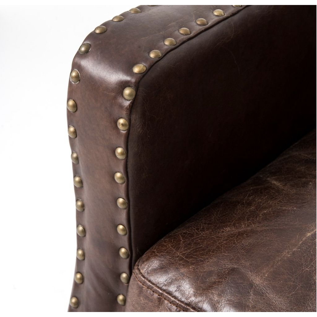 antique brass details on armchair