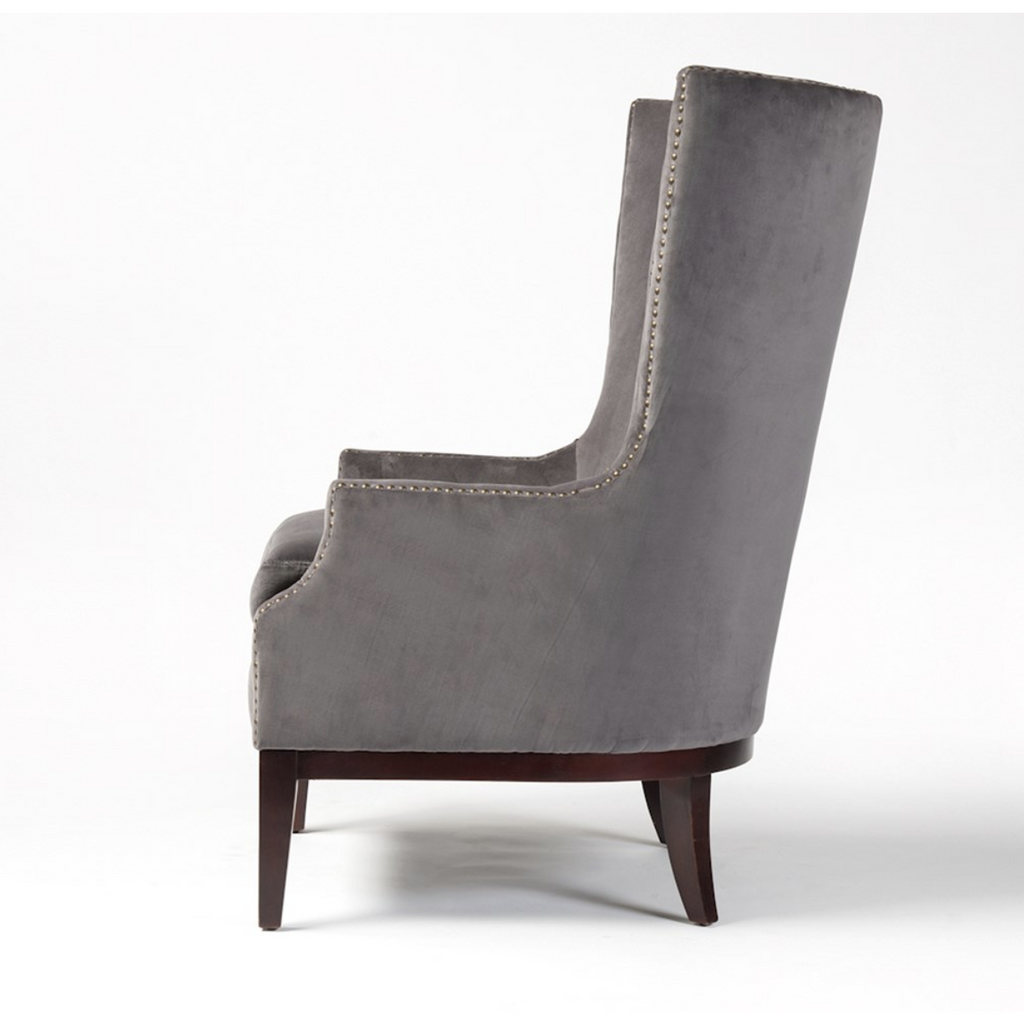 side view of grey velvet chair